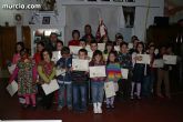 Homenaje a los portapasos infantiles de la Cofradía de San Juan Evangelista
