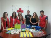 Jóvenes de IU colabora con la campaña de recogida de material escolar de Cruz Roja Juventud