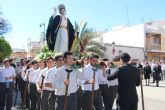 Los niños del San Pedro Apóstol inician la Semana Santa con el traslado de San Juan Evangelista