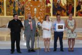 Arturo Ponce recibe el premio de fotografía de la Semana Santa pinatarense