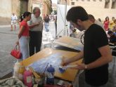 Diez pintores muestran su maestra en la Plaza Belluga pintando 'El mar y las ciudades'