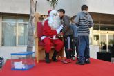 Pap Noel recibe a decenas de niños en San Javier y Santiago de la Ribera