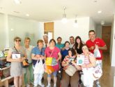 Los alumnos del Centro de Día de discapacidad intelectual José Moya Trilla visitan el centro de lectura José María Munuera y Abadía