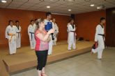 Más de sesenta niños y niñas de las ludotecas de verano asisten a una exhibición de Taekwondo