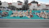 La calle Mayor de Canteras se convierte en un lienzo de arte urbano