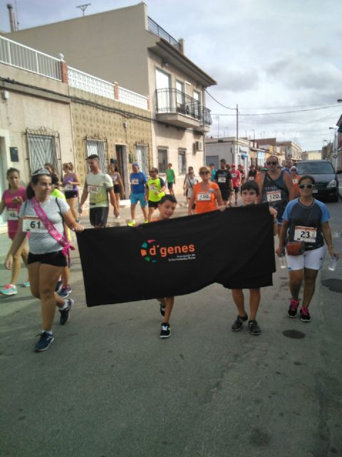 Más de un centenar de personas toman parte en la I Marcha Solidaria en el barrio cartagenero de Los Dolores, a beneficio de D´Genes - 2, Foto 2