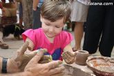 Los más pequeños conocen de cerca el trabajo del alfarero gracias a las actividades que han integrado el programa de las Fiestas del barro - 24