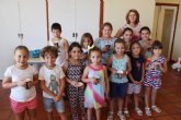 Cerca de una veintena de niños y niñas participan en el Taller de Cocina Creativa y Divertida que se celebra en las cocinas del Centro Sociocultural “La Crcel”