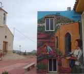 El Ayuntamiento de Lorca finaliza el nuevo mural decorativo en Rincón de los Carranzas, un homenaje a sus olivos milenarios y su histórico lavadero
