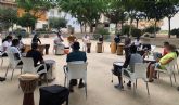 15 menores del barrio del Carmen disfrutan de un taller de percusión al aire libre