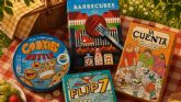 La nevera port�til, la tartera, un mantel y unos buenos juegos de mesa