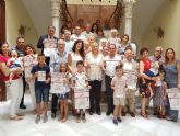 Cartagena por la Caridad destina los beneficios de las pulseras solidarias Comprometida-Comprometido a siete entidades