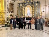 La Agrupación Musical Virgen de la Amargura entrega a Cáritas un cheque de 2.060 euros