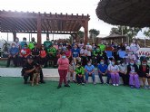 Usuarios y monitores del centro de día reciben la visita de la unidad canina de la Policía Local de Mazarrón