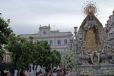 Cultura. Sevilla . La Virgen de las Angustias de Alcalá del Río, ataviada de reina y exornada con flores blancas para el simbólico acto del traslado a su capilla